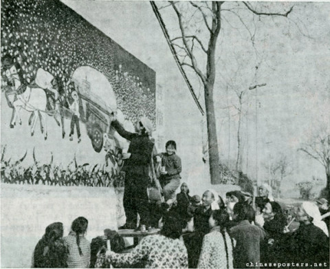 The author paints her mural, Joyful Cotton Picking, on a village wall